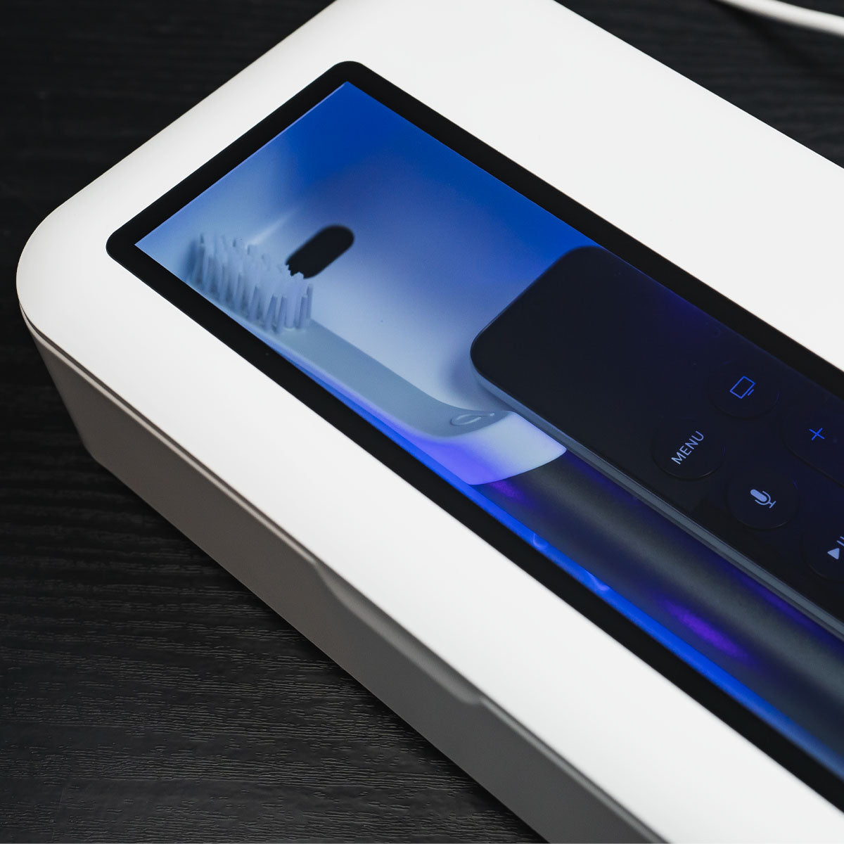 CleanTrayCharage_Toothbrush_Remote_UVLightOn_1200x1200_f9fcae87-0971-44d3-a523-cd21e13221b2